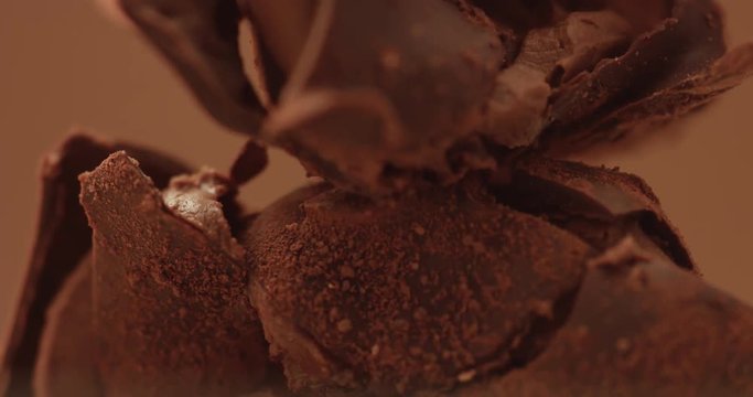 chocolate truffle texture closeup with different chocolate texture. man's hand breack a truffle sweet