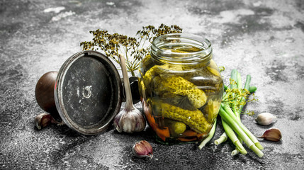 Pickled cucumbers with seamer.
