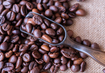 coffee beans in scoop on burlap