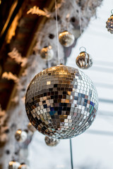Mirror Ball and Christmas Ornaments in a Window - 187117809