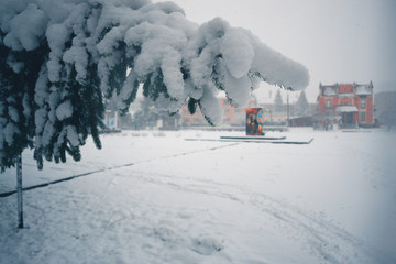 Winter day in a snowfall in the town.