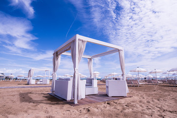 Wooden lounge bed for relaxing on the beach of lido di jesolo