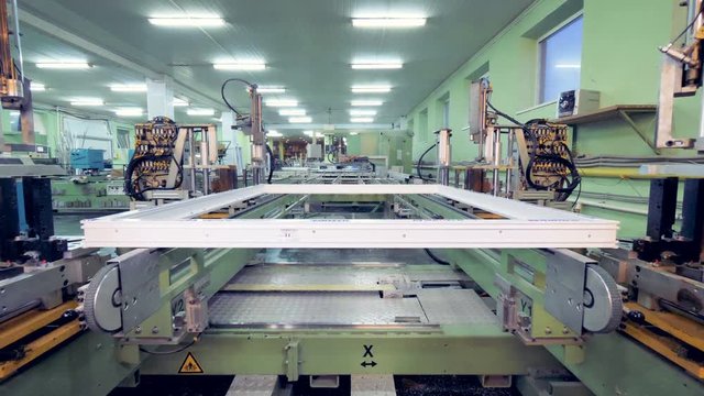 Timelapse production process of window. Conveyor line in action.