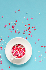 Coffee cup with colorful hearts