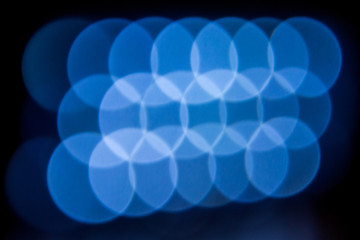 bright white fuzzy lights glow and shine on a dark background_