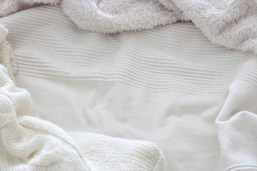 Fototapeta na wymiar Background of white shaggy blanket texture.