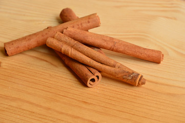 cinnamon with wood background 
