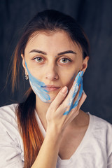 beautiful woman painted with many vivid colors.