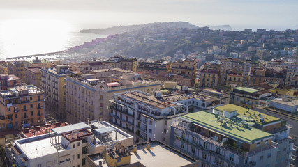 Aerial view of the Gulf of Naples from the Vomero district, in Italy. In the background are Posillipo, Mergellina and the island of Nisida beyond the city's port. Around there are houses and buildings