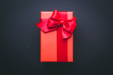 red gift box on a black background