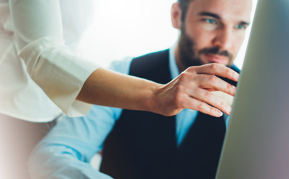 Bearded young businessman working on office. Director man thinking looking in monitor computer. Managers meeting. Idea, alalyze marketing plans. Workplace concept, startup project