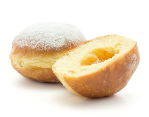 One doughnut (Sufganiyah) and one sliced half with apricot jam isolated on white background fresh baked with powered sugar and without hole.