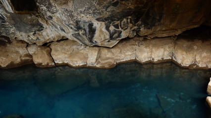 Inside the cave with thermal spring, Iceland