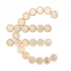 symbol of euro made of coins, the sign is on white background