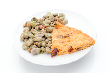 Typical dish combined Spanish beans with bacon and chorizo omelet