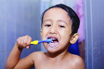 Kids Brush His Teeth In Bathroom