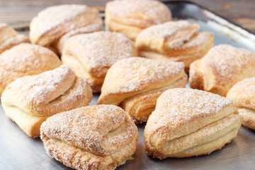 Home made cookies on baking pan.