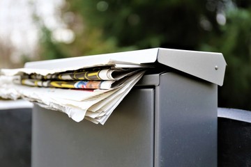 An concept Image of a Mailbox with a newspaper