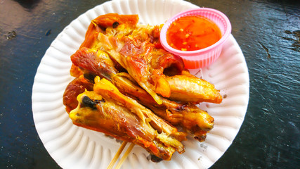 Street fastfood. Chicken grill with hot sauce