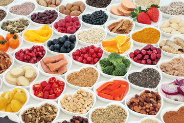 Health food for a healthy heart concept with vegetables, fruit, fish, nuts, seeds, supplement...