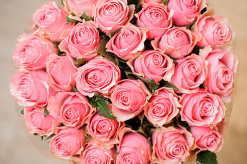 elegant bouquet of roses rose-coloured close up on white background