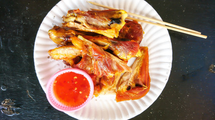 Street fastfood. Chicken grill with hot sauce