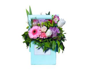 bouquet of flowers in a wooden box on a white background. Valentine's Day