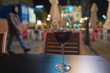 red wine glass on the table in the streets