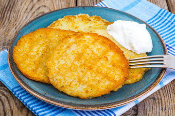 Potato pancakes with sour cream