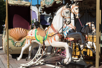 White horses of the antique carousel