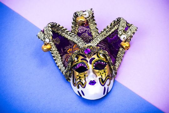 Mardi Gras Festival. Luxurious masquerade Venetian carnival mask on purple background