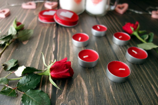 Red rose and romantic decorations on wooden board, Valentine`s day concept