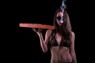 girl holding pizza box smoking