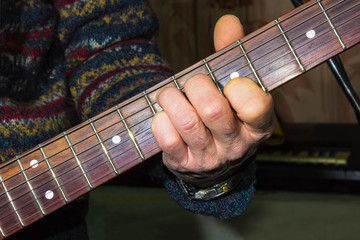 Practicing in playing guitar.