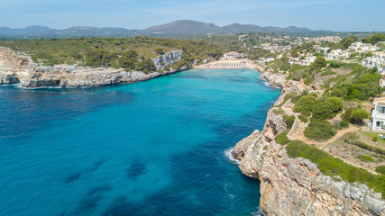 Drone aerial landscape of the beautiful bay of Cala Anguila with a wonderful turquoise sea, Porto Cristo, Majorca, Spain