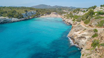Fototapeta premium Drone aerial landscape of the beautiful bay of Cala Anguila with a wonderful turquoise sea, Porto Cristo, Majorca, Spain