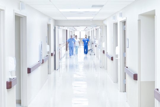Doctors walking down hospital corridor