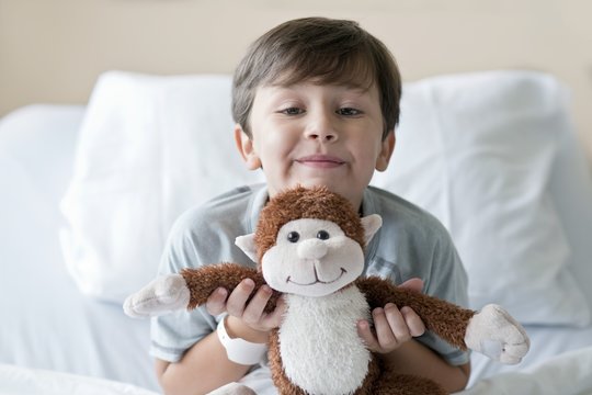 Boy in hospital with teddy bear