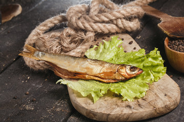 Fried fish on plate with vegetables