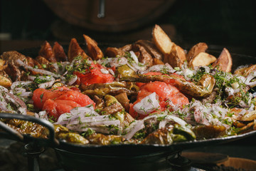 Grilled meat and vegetables on rustic wooden table