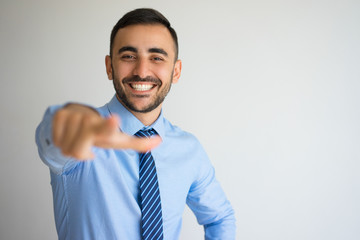 Laughing Office Worker Pointing at Camera