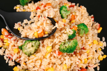 Plate with rice pilaf and broccoli, closeup