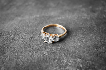 Beautiful engagement ring on gray background