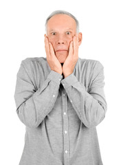 Emotional mature man in casual clothes on white background