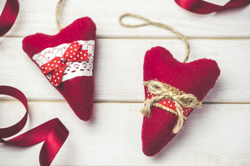 Decorative heart on a wooden white table. A symbol of love. Valentine's Day.
