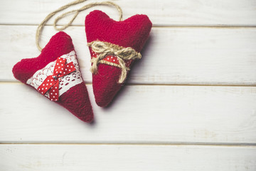 Decorative heart on a wooden white table. A symbol of love. Valentine's Day.