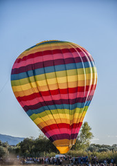 A hot air balloon, in preparation for take-off
