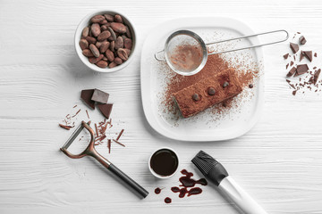 Composition with tasty chocolate cake on wooden background