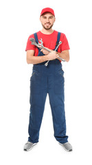 Handsome auto mechanic with tools on white background