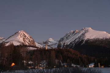  scenery of snow covered High Tatras mountains in the night in Slovakia